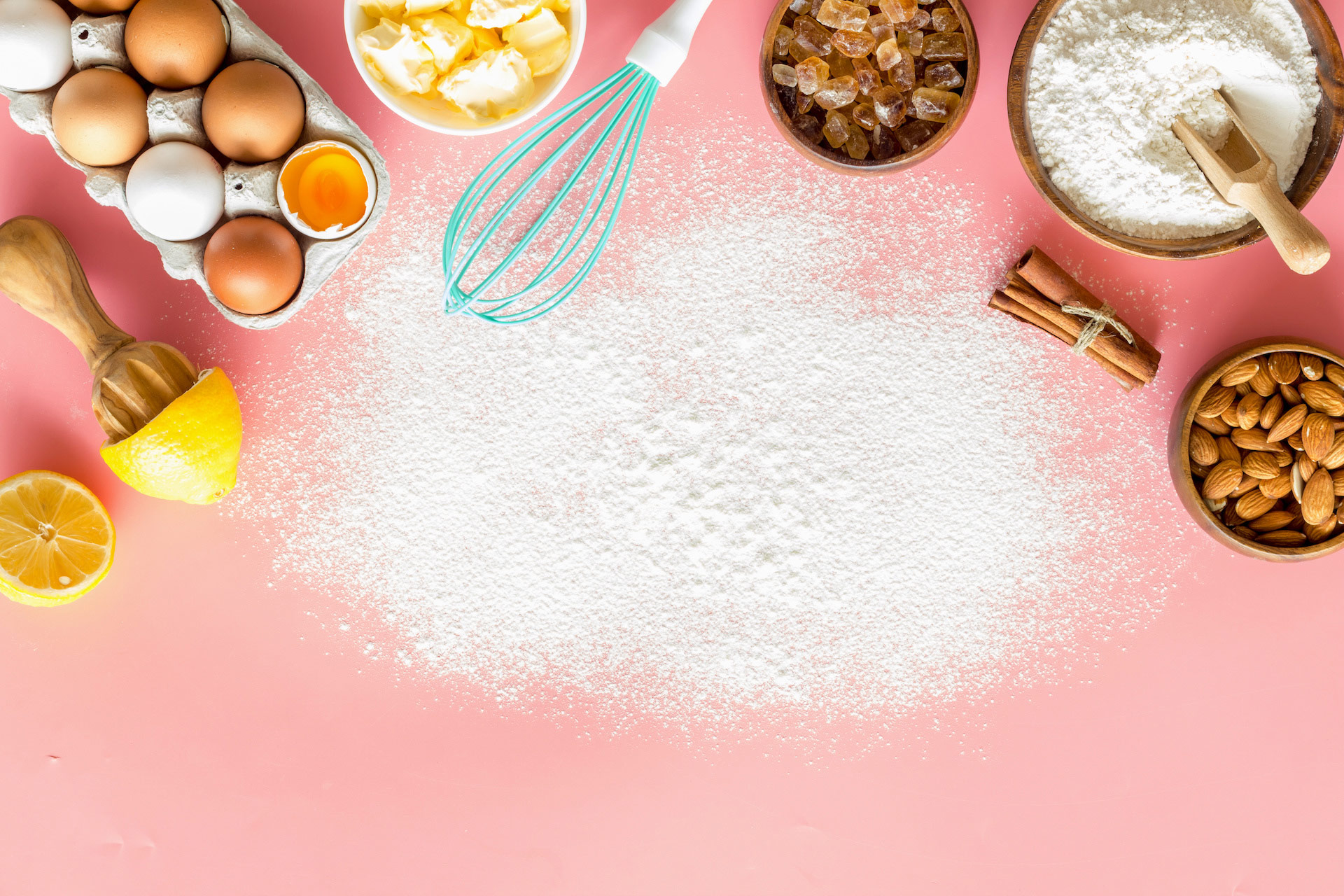 Ingredients and utensils for baking on a pastel background